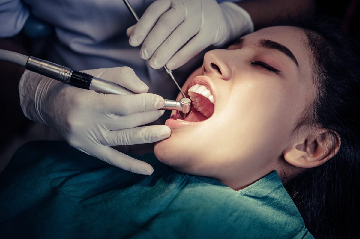 dentists-treat-patients-teeth-scaled-1200x798.jpg